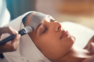 Image showing Facial, mask and cosmetic treatment for woman in spa for relax, wellness and beauty for break and skincare. Young person with eyes closed and towel on head with product on face for hygiene and care