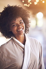 Image showing Spa, woman and portrait with smile in a bathrobe for wellness, cosmetics and beauty treatment. Health, skincare and resort with an African female person ready for dermatology at a hotel with bokeh
