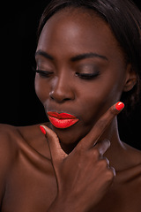 Image showing Black woman, lipstick and nail polish for beauty, cosmetics and bright makeup color on dark background. Bold, vibrant and orange lip balm with manicure, cosmetology and pose for glamour in studio