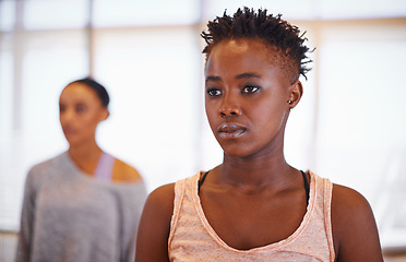 Image showing Dancer, African woman and training in class with vision for choreography, moving and exercise for art. Girl, person and dancing in studio for ballet, performance and workout with idea for creativity