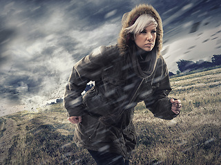 Image showing Woman, forest and running in storm weather, nature and survival or safety for climate change. Athlete, warm jacket or strong in woods with rain, environment or runner for global warming as warning