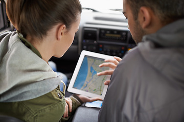 Image showing Couple, car and map on road trip with navigation for direction, vacation and travel to destination in countryside. Woman, man and tablet in vehicle for tech or location to holiday journey and tourism