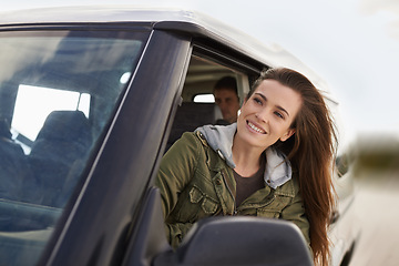 Image showing Woman, car or window to explore on road trip as thinking, planning or idea of travel and adventure. Smile, female person or traveler on fun driving holiday in motor transport as journey of leisure