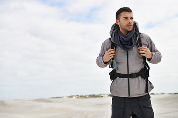 Image showing Backpack, travel or fitness man in desert for adventure, journey or resort, location and exploration. Outdoor, holiday or male backpacker in Egypt for sand dunes walking, wellness or hiking in nature