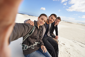 Image showing Friends, smile and selfie in desert for adventure on holiday, road trip and travel together in California. People, happy and excited in sand dunes for vacation or break with bonding for memory.