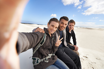 Image showing Friends, desert and selfie with smile for adventure in happiness for holiday, road trip and travel together. People, memory and excited in sand dunes for vacation or break with bonding for fun