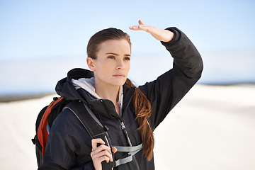 Image showing Hiking, sand dunes and woman in nature walking for adventure, desert landscape and travel for holiday. Hiker, explorer and nomad person in Sahara terrain, outdoor and dry climate for view or scenery