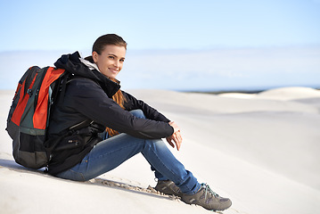 Image showing Portrait, sand dunes or woman in nature to relax for adventure, desert landscape and travel for holiday. Break, hiking or nomad explorer in Sahara terrain, outdoor and dry climate for view or scenery