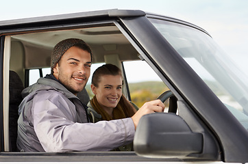 Image showing Couple, car and portrait on road trip with travel for adventure, vacation and anniversary getaway with happiness in nature. Woman, man and driving in vehicle for holiday journey, tourism or honeymoon