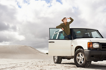 Image showing Road trip, car and woman in a desert for location, search or holiday, adventure and exploration. Travel, stop and female person with vehicle in Egypt for sand dunes journey, nature or waiting outdoor