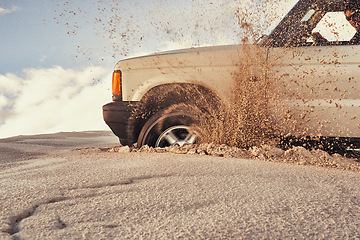 Image showing Car, desert and drive with sand and transport outdoor, off road vehicle for dunes and journey on vacation. Van, 4x4 and SUV with travel adventure, exploration and destination for tourism in Dubai