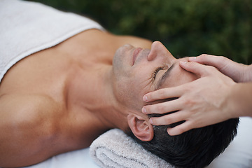 Image showing Spa, man and face with massage for wellness at resort, luxury hotel and vacation for relax and therapeutic pamper. People, masseuse and body care with facial treatment, hospitality and hands outdoor