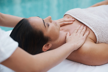Image showing Hands, woman and masseuse at spa for massage, health and wellness for zen, therapy or peace. Female person, lady or relax for luxury, body or wellbeing on table, natural or calm near pool