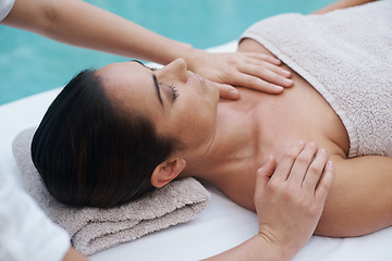 Image showing Hands, woman and luxury at spa for massage, skin care and wellness for health, therapy and peace. Female person, lady and relax for zen, body and tranquil on table, calm and wellbeing near pool