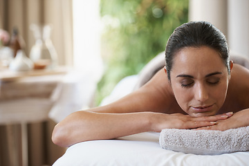 Image showing Spa, treatment and zen woman on massage table, salon and beauty therapist in wellness centre. Peaceful, smile and reflexology for body and relax, pamper and skin care for sleeping female client