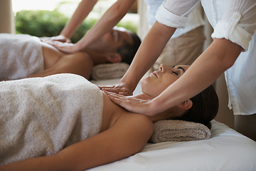 Image showing Massage, relax and couple in spa for touch, wellness and therapy on holiday or vacation for break and pamper. Young people and lay with head on towel for holistic care and peace for calm on table