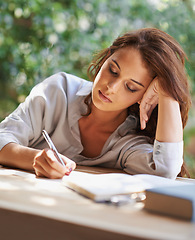 Image showing Student, woman and write notes to study with books for revision, exam preparation at home. Female person outdoor and diary with test or assignment deadline and schedule for distance learning.