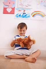 Image showing Floor, smile or child with teddy bear for playing or development and growth in home in playroom. Happiness, activity and playful with a fluffy toy, young toddler kid and fun games for entertainment