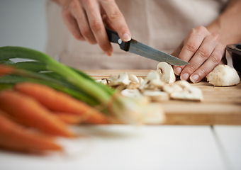 Image showing Cooking, food and hands with vegetables in kitchen on wooden board for cutting, meal prep and nutrition. Healthy diet, ingredients and person with mushrooms for vegetarian dinner, lunch and salad