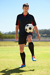 Image showing Man, stadium and football for training with workout or practice for game with fitness and competitive in France. Male person, player and exercise for sport or soccer career with warm up for match