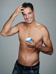 Image showing Hairstyle, man and smile in portrait with gel for haircare, cosmetics and cosmetology for confidence. Mature person, beauty and male guy in studio for hair routine or treatment in gray background