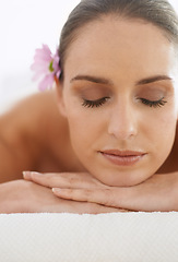 Image showing Relax, massage and face of woman at spa for health, wellness and balance with luxury holistic treatment. Self care, zen and girl on table for body therapy, comfort and calm pamper service at hotel