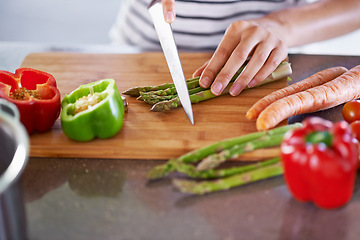 Image showing Chopping, healthy and cooking in home kitchen, organic food or meal prep with fresh produce. Diet, nutrition and cutting board for wellness ingredient, pepper asparagus or carrot in vegan lunch snack