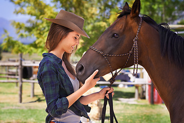 Image showing Cowgirl, happy and woman with horse at farm outdoor in summer or nature in Texas for recreation. Western, smile and female person with animal at ranch, pet or stallion in the countryside together