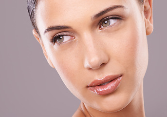 Image showing Woman, studio and thinking with beauty, skincare and gloss for makeup and glamour model in face zoom. Female person, eyebrow and glow for lipstick, foundation and isolated on grey background cosmetic