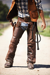 Image showing Person, outdoors and gun ready to shoot for standoff or gunfight in duel for wild western culture in Texas. Cowboy gunslinger or outlaw, revolver and confrontation for defense or conflict with battle