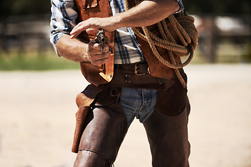 Image showing Cowboy, confrontation and aim gun to shoot for standoff or gunfight in duel for wild western culture in Texas. Male gunslinger or outlaw, revolver and tough for defense or conflict with closeup