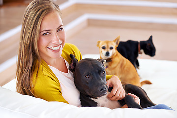Image showing Portrait, woman and dogs on sofa in house, home and living room with affection for pets. Female person, puppies and smile in apartment, lounge and place of residence in Paris on couch to relax