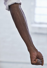 Image showing Strong, person and vein from muscle in arm with fist for power in white background or fashion. African, hand and forearm of model with healthy fitness, wellness or muscular bodybuilder in office