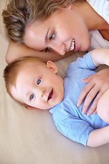 Image showing Baby, bonding and happy with mother, relaxing and love together with child and care for motherhood. Infant, mom and smile for affection, nurture and home for growth and babysitting with family