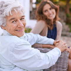 Image showing Portrait, elderly and mother together with daughter in nursing home, outdoor and woman to visit wise mom. Girls, smile and holding hands as family, happy and retirement of senior female person