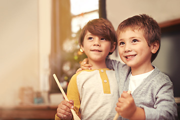 Image showing Children, baking and thinking in kitchen with spoon and creative with ingredients for christmas cake. Boys, bonding together and care for cookies in house and pastry recipe for holiday celebration