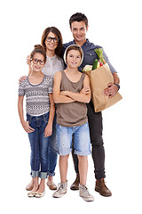 Image showing Happy family, portrait and shopping bag with vegetables for food, natural sustainability or nutrition on a white studio background. Mother, father and children with smile for ingredients or groceries