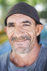 Image showing Portrait , smile and happy senior man in nature, outdoors and wrinkles from sunlight exposure. Grandfather, face and aged male from Brazil , closeup and local rainforest natural and retired