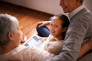 Image showing Child, grandparents and tablet on couch in home or online game or communication, teaching or connection. Elderly couple, retirement and girl or internet learning in apartment, development or bonding