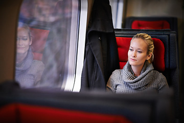 Image showing Woman, travel and thinking on train for holiday with adventure, trip and leisure with journey in France. Female person, commute and vacation on public transport as tourist for break and destination