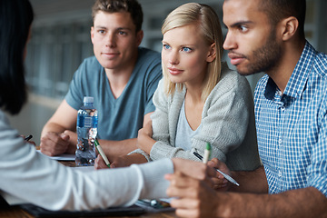 Image showing Education, college and students in studying together for learning, share ideas and research for project. Paper, writing and academic discussion for assignment on campus, diversity and scholarship