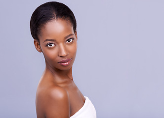 Image showing Beauty, skincare and portrait of serious black woman with glowing skin, natural spa makeup and studio space. Mockup, dermatology and luxury cosmetics with healthy face of girl on grey background.