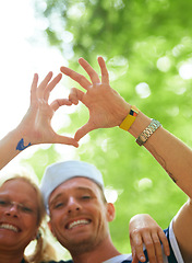 Image showing Portrait, festival and couple with heart sign, love and happiness with romance gesture and celebration. Face, people and outdoor with man and woman with symbol for love and marriage with joy