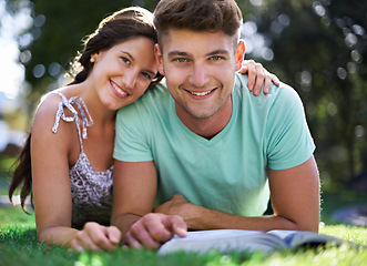 Image showing Happy, grass and portrait of couple with books for reading, learning and studying together outdoors. University, college and man and woman with textbook in park for bonding, relax and rest on campus