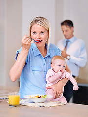 Image showing Woman, breakfast and thinking with baby in morning for daily routine, planning and eating in kitchen. Mother, infant and standing in house with vision, ideas and nurture of child in family home