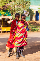 Image showing Ethiopian teenagers covered with a blanket to keep out the cold. Demebecha, Ethiopia