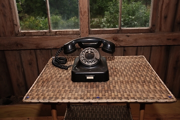 Image showing black vintage rotary telephone