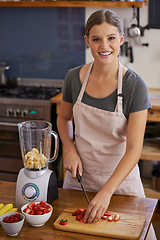 Image showing Woman, portrait and fruit smoothie in kitchen for weight loss nutrition, healthy or vitamins. Female person, face and knife with cutting board for juicer shake or blender, ingredients or preparation