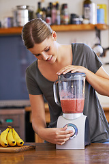 Image showing Kitchen, smile and woman on blender for smoothie, nutrition or food for healthy diet at table in home, Happy person, fruit and mixer for drink, juice or ingredients for wellness with organic beverage