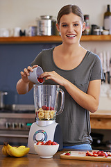 Image showing Portrait, smile and woman on blender for smoothie, nutrition or food for healthy diet at table in home kitchen. Happy person, face and fruit mixer with strawberry for wellness and organic banana